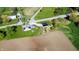 Aerial view of a charming home with a lush green yard, a convenient bridge, and a big lot at 10776 S 250 W, Flat Rock, IN 47234