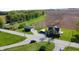 An aerial view shows the property's rural location with the home, outbuilding, fields, and stream at 10776 S 250 W, Flat Rock, IN 47234