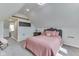 Bright bedroom offers carpet floors, a bed, and a side access to the hallway at 10776 S 250 W, Flat Rock, IN 47234
