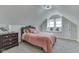 Charming bedroom features carpet floors, a bed, and a window seat nook at 10776 S 250 W, Flat Rock, IN 47234