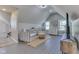 Bright bonus room features vaulted ceilings, gray wood floors, natural light, and cozy seating at 10776 S 250 W, Flat Rock, IN 47234