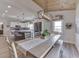 Dining area connected to the kitchen, featuring a stylish light fixture and decor at 10776 S 250 W, Flat Rock, IN 47234