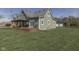 Charming home with a spacious backyard, wooden deck, and an additional storage building at 10776 S 250 W, Flat Rock, IN 47234