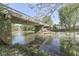 Picturesque view of a bridge over a river surrounded by lush greenery and mature trees at 10776 S 250 W, Flat Rock, IN 47234