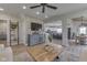 Open-concept living room with modern entertainment center, and hardwood flooring throughout at 10776 S 250 W, Flat Rock, IN 47234