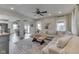 Bright living room boasts a decorative rug, stylish furniture, and a large picture window at 10776 S 250 W, Flat Rock, IN 47234