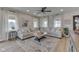 Comfortable living room features a large sectional sofa, ceiling fan, and natural light at 10776 S 250 W, Flat Rock, IN 47234