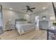 Cozy main bedroom featuring neutral tones, a ceiling fan, and a stylish headboard at 10776 S 250 W, Flat Rock, IN 47234