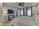 Comfortable main bedroom featuring a large television and multiple windows with natural light at 10776 S 250 W, Flat Rock, IN 47234
