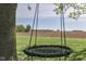 Outdoor fun with a tree swing overlooking farmland and a tranquil landscape at 10776 S 250 W, Flat Rock, IN 47234