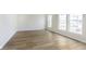 Bright, open living room featuring hardwood floors and large windows at 10959 Belgian Ln, Zionsville, IN 46077
