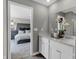 Well-lit bathroom featuring double sinks and a view into the main bedroom at 1178 Turner Trace Pl, Avon, IN 46123