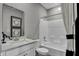 Bathroom featuring a vanity sink, toilet, and a shower over tub with tiled enclosure at 1178 Turner Trace Pl, Avon, IN 46123
