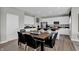 Bright dining area with modern table and chairs, seamlessly connected to the kitchen with stainless steel appliances at 1178 Turner Trace Pl, Avon, IN 46123