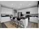 Modern kitchen with an island featuring bar stool seating, granite countertops, and stainless steel appliances at 1178 Turner Trace Pl, Avon, IN 46123