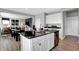 Modern kitchen features white cabinets, dark granite countertops, and stainless steel appliances at 1178 Turner Trace Pl, Avon, IN 46123