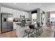 Bright eat-in kitchen features stainless steel appliances, granite counters, and a center island with seating at 1178 Turner Trace Pl, Avon, IN 46123