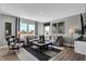 Comfortable living room with large windows, stylish decor, and a cozy seating area at 1178 Turner Trace Pl, Avon, IN 46123