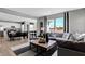 Open-concept living room with hardwood floors, modern furniture, and bright natural light at 1178 Turner Trace Pl, Avon, IN 46123