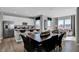 Open-concept living room featuring a kitchen, dining area, and a comfortable seating area filled with natural light at 1178 Turner Trace Pl, Avon, IN 46123