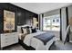 Cozy main bedroom showcasing a large window, decorative wall accents, and a bedside table at 1178 Turner Trace Pl, Avon, IN 46123