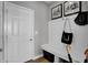 Mud room with built-in bench and coat rack adjacent to the entry door at 1178 Turner Trace Pl, Avon, IN 46123