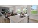 Open-concept kitchen with a view to the dining and living areas, and backyard at 11833 Vale St, Indianapolis, IN 46235