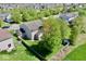 Aerial view of a home with a large, fenced backyard, mature trees, and a storage shed, offering privacy and space at 1234 Yellowstone Way, Franklin, IN 46131