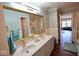 Elegant bathroom showcasing double sinks, granite countertops, and a large framed mirror at 1234 Yellowstone Way, Franklin, IN 46131