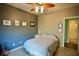 Comfortable bedroom featuring neutral carpeting, a ceiling fan, and ensuite bathroom access, creating a private retreat at 1234 Yellowstone Way, Franklin, IN 46131