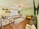 Upstairs bonus room featuring modern furnishings, a large sectional, and a ceiling fan at 1234 Yellowstone Way, Franklin, IN 46131