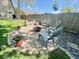 Cozy firepit area with comfortable seating and decorative potted plants, creating an inviting outdoor space at 1234 Yellowstone Way, Franklin, IN 46131
