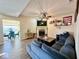 Open living room with a fireplace, large sectional couch, and modern decor, creating a comfortable gathering space at 1234 Yellowstone Way, Franklin, IN 46131