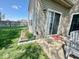 Back patio with sliding glass doors, perfect for indoor-outdoor living and entertaining, plus adjacent landscaped garden at 1234 Yellowstone Way, Franklin, IN 46131