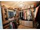 Spacious walk-in closet with custom shelves, hanging racks, carpet floors, and plenty of storage at 1234 Yellowstone Way, Franklin, IN 46131