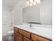 Bathroom features a combination shower and tub with a large mirror and wood vanity at 126 Appian Way, Anderson, IN 46013
