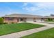 Inviting home exterior with a lush green lawn and convenient driveway at 126 Appian Way, Anderson, IN 46013