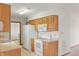 Functional kitchen with white appliances and plenty of wooden cabinet space at 126 Appian Way, Anderson, IN 46013