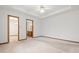 Spacious main bedroom with a ceiling fan, and doorways to a bathroom and walk-in closet at 126 Appian Way, Anderson, IN 46013
