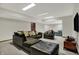 Finished basement with comfortable seating, carpet, and a TV at 13494 Dallas Ln, Carmel, IN 46033