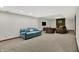 Finished basement with blue couch, fireplace and comfortable seating at 13494 Dallas Ln, Carmel, IN 46033
