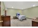 Cozy bedroom featuring neutral walls, carpeted floors, and comfortable furnishings at 13494 Dallas Ln, Carmel, IN 46033