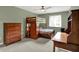 Comfortable bedroom with wood bunk bed set with storage and ceiling fan at 13494 Dallas Ln, Carmel, IN 46033