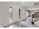 Bright foyer with tile flooring, elegant front door with leaded glass, and staircase at 13494 Dallas Ln, Carmel, IN 46033