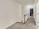 Upstairs hallway with neutral carpet and view into a blue bedroom at 13494 Dallas Ln, Carmel, IN 46033