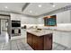 Bright kitchen featuring white cabinets, granite countertops, stainless steel appliances and a center island at 13494 Dallas Ln, Carmel, IN 46033