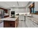 This kitchen features stainless steel appliances, granite countertops, white subway tile, white cabinets, and a kitchen island at 13494 Dallas Ln, Carmel, IN 46033