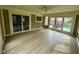 Enclosed sun room with tile flooring and multiple access points to the backyard at 13494 Dallas Ln, Carmel, IN 46033