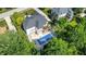 A high angle view reveals this luxurious backyard with its spacious pool and beautiful outdoor patio area at 13934 Salsbury Creek Dr, Carmel, IN 46032