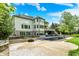 Spacious backyard showcases a covered pool, multiple decks, and mature trees offering privacy at 13934 Salsbury Creek Dr, Carmel, IN 46032